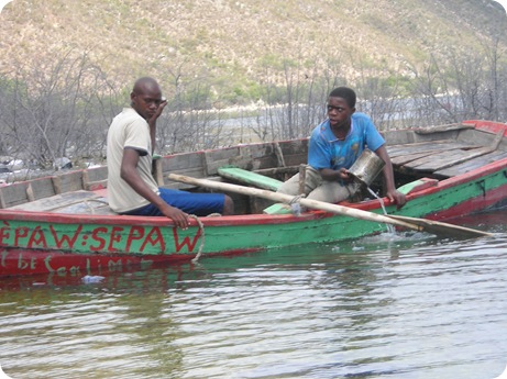haitian men in canoe