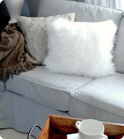 white faux fur pillow in guest house