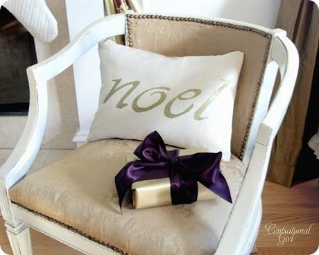 cg noel pillow in chair