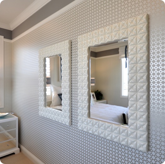 pair of mirrors and wallpaper