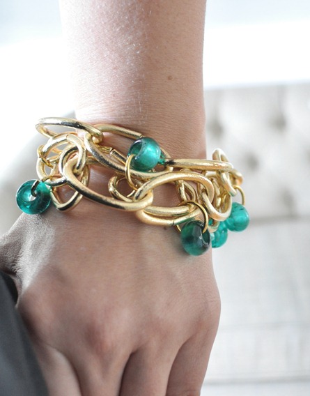 gold link bracelet on wrist