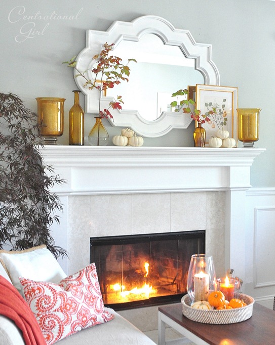amber bottles and mirror on mantel