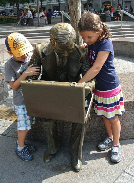 bronze statue and kids