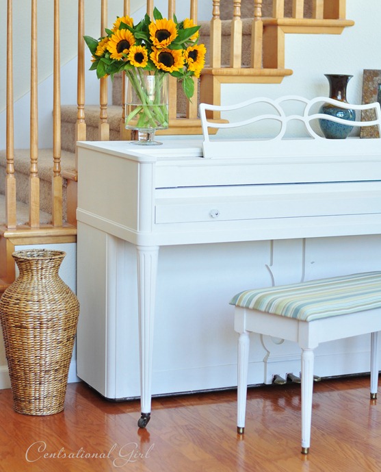 painted white piano by stairs