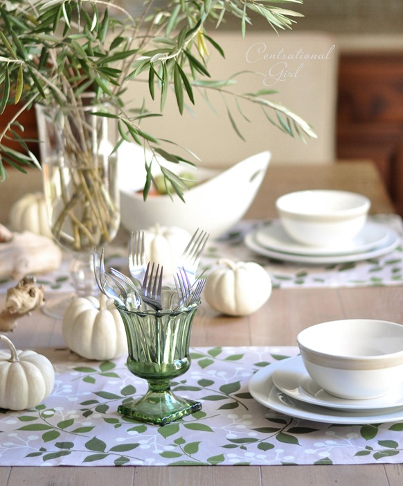 green glass urn and white place settings