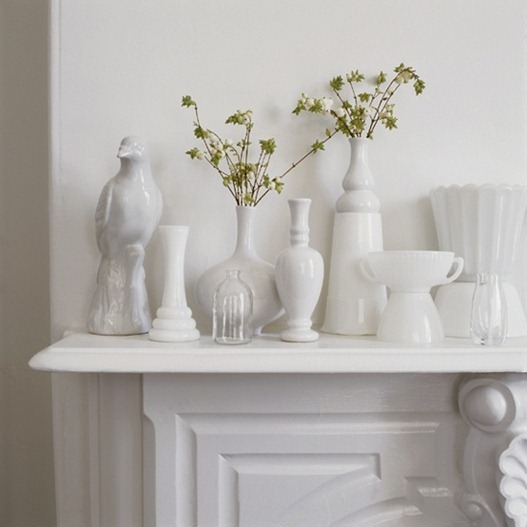 simple white vessels on mantel