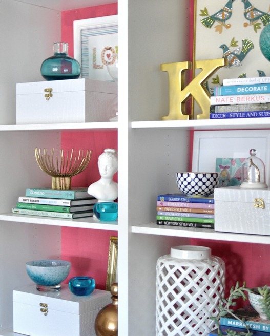 pink and white bookcases