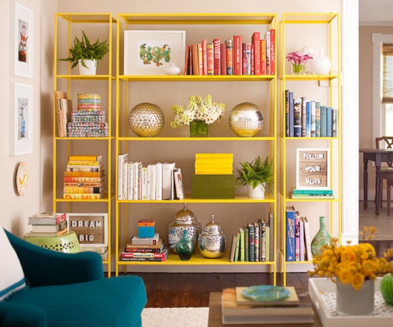 yellow painted bookshelves bhg