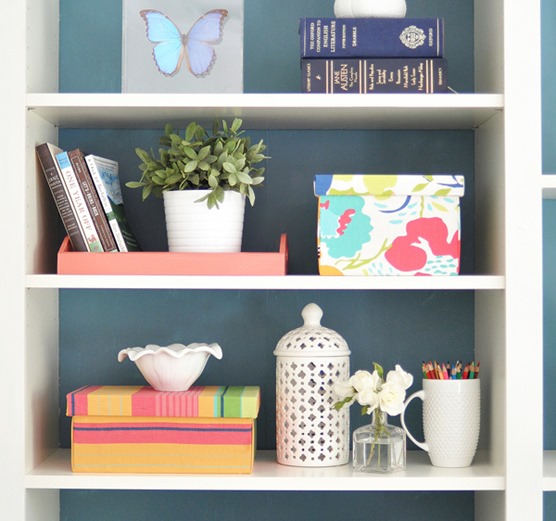 fabric covered boxes on shelf