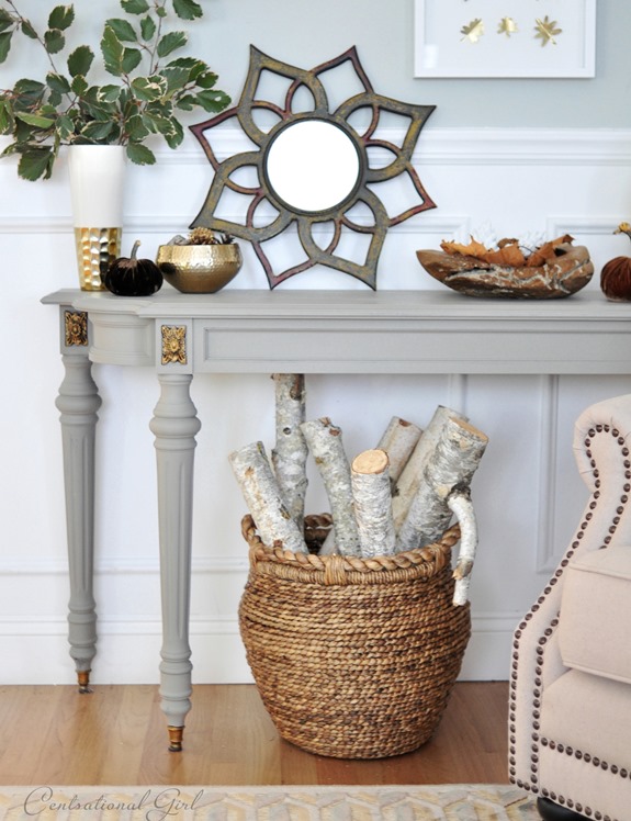 basket of logs under gray console