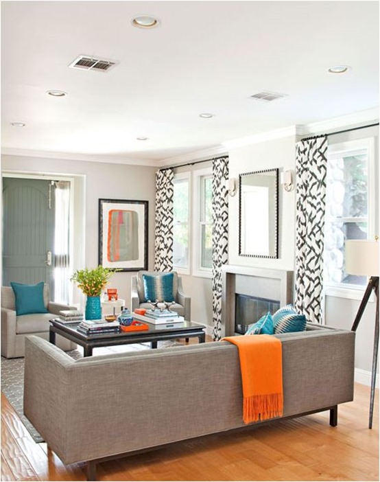 orange throw and tray in living room bhg