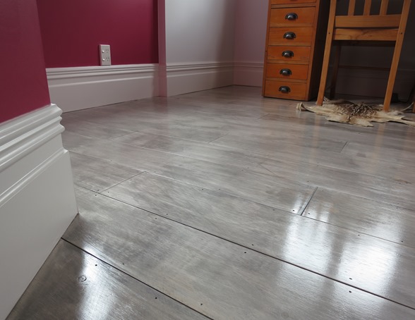 gray painted plywood plank floors