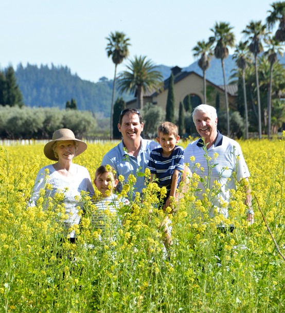 family in mustard flowers