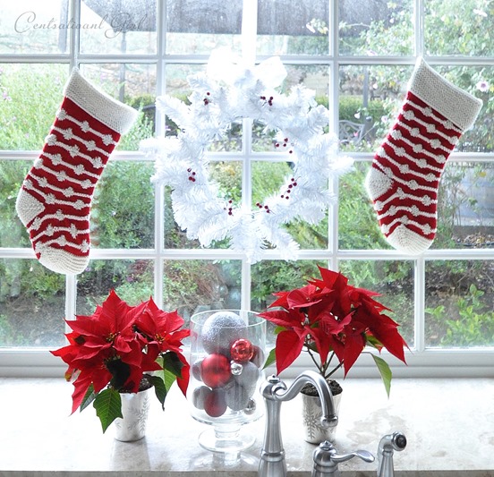 poinsettias and wreath kitchen window