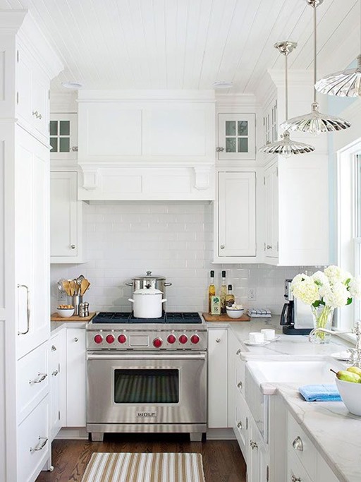 white kitchen under cabinet range hood