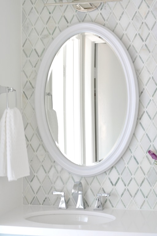 white oval vanity mirror