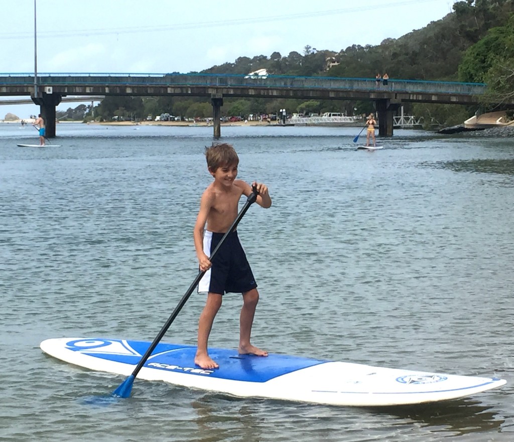 boy paddleboarding